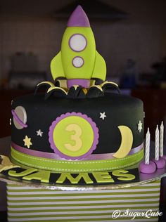 a birthday cake with a rocket on top