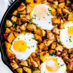 fried eggs and potatoes in a skillet