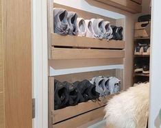 there are many pairs of shoes on the shelves in this closet, and one is empty