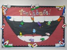 a bulletin board with toothbrushes on it that says toothbugs and other cartoon characters