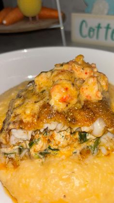 a white plate topped with food on top of a table