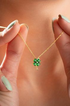 Embrace the luck of the Irish with our charming four leaf clover necklace. Crafted with a vibrant green hue, this lucky charm pendant exudes both elegance and fortune. Each delicate leaf symbolizes hope, faith, love, and luck, making it the perfect accessory for those seeking a touch of serendipity in their lives. Whether you're celebrating your Irish heritage or simply seeking a stylish talisman, this necklace is sure to bring a smile to your face. Handcrafted with care and attention to detail, 4leaf Clover Necklace, Clover Jewelry, Gold Jewellry, Four Leaf Clover Necklace, Clover Pendant, Clover Charm, Irish Heritage, Clover Necklace, Emerald Jewelry