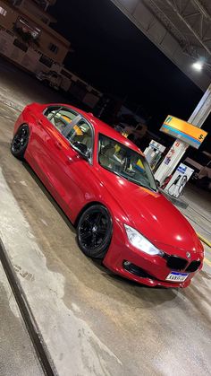 a red car parked in a parking garage