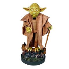 a statue of yoda from star wars is shown in front of a white background