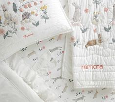 two baby blankets with embroidered animals on them and the name ramona written in red