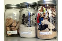 three jars filled with different types of items