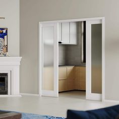 an empty living room with white furniture and fireplace