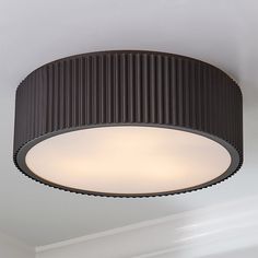 a round light fixture hanging from the ceiling