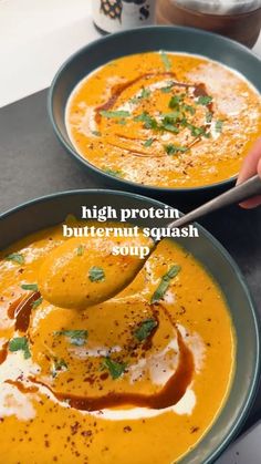 two bowls of soup with spoons in them and the words high protein butternut squash soup