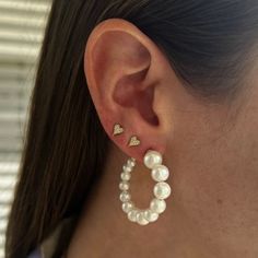 These stunning pearl hoops bring a beautiful twist to a classic style that's great for a special occasion! Available in 14K Yellow Gold Hoop diameter = 1.5in Luxury Small Hoop Yellow Gold Pearl Earrings, Pave Heart Necklace, Pave Bangle, Star Bangle, Gold Waves, Gold Bead Bracelets, Pearl Hoop Earrings, Initial Ring, Star Bracelet