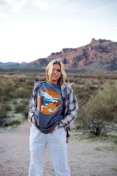 One of our most favorite designs is back and better. Meet the Rocky Mountain Tee-your new favorite graphic tee. Crafted in the USA, this tee is the perfect addition to your outdoorsy wardrobe. Whether you're summiting peaks or busting a move with the local wildlife, our tee ensures you're effortlessly rocking the Rockies in style! 🏞️🎉 Graphic Tee For Hiking With Relaxed Fit, Relaxed Fit Graphic Tee For Hiking, Graphic Tee With Relaxed Fit For Outdoor Activities, Relaxed Fit Graphic Tee For Outdoor Activities, Casual Graphic Print Tops For Outdoor Activities, Relaxed Fit Graphic Print Top For Adventure, Casual Outdoor Tops With Front Print, Casual Tops With Front Print For Outdoor Activities, Outdoor Relaxed Fit Top With Front Print