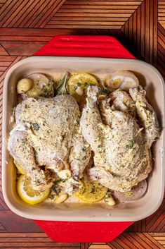 chicken with lemons and herbs in a casserole dish