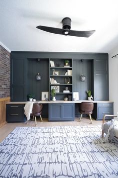 a living room filled with furniture and a ceiling fan