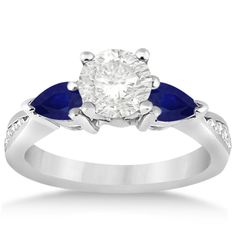 a diamond and blue sapphire engagement ring