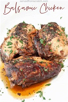 balsamic chicken on a white plate with mustard and parsley garnish