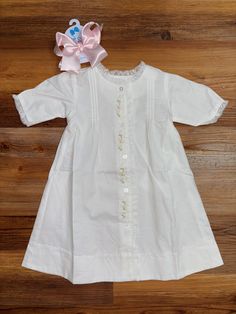 The Kelly Daygown Girl is the perfect option for bringing a touch of elegance to any little girl's wardrobe. This daygown is made from a softly woven cotton fabric and features ruffles and floral embroidery for the ideal blend of sophistication and comfort. 120423bb Girls Wardrobe, Woven Cotton, Cotton Weaving, Floral Embroidery, Front Porch, Ruffles, Clothing And Shoes, Baby Clothes