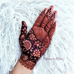 a henna on someone's hand that is laying down