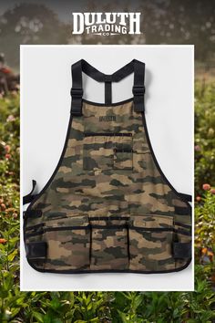 a camo apron hanging on the side of a wall with an advertise