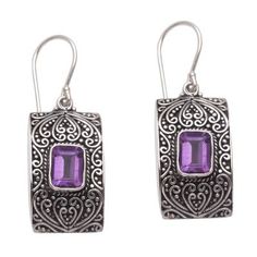 Artisan Eka Devi creates this sophisticated pair of dangle earrings with time-honored techniques and traditional Balinese design. She uses sterling silver to craft the rectangular earrings decorating each one with gorgeous bun and jawan motifs that shimmer against an oxidized base. Three carats of gorgeous faceted amethyst glisten magically from bezel settings completing the elegant design of timeless appeal. Balinese Design, Women Suits Wedding, Rectangular Earrings, Special Occasion Jewelry, Women's Suiting, Dragonfly Earrings, Sterling Silver Dangle Earrings, Amethyst Earrings, Balinese