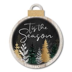 a wooden ornament with the words tis the season written in white and gold