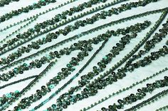 Emerald green sequins and clear green beads on an emerald green mesh. Green Glamorous Sequin Fabric For Festive Occasions, Glamorous Green Sequin Fabric For Festive Occasions, Elegant Green Sequin Fabric, Embellished Green Sequin Fabric, Embellished Green Glamorous Sequin Fabric, Embellished Green Sequin Fabric For Festive Occasions, Green Embellished Sequin Fabric For Festive Occasions, Festive Green Embellished Sequin Fabric, Glamorous Green Embellished Sequin Fabric