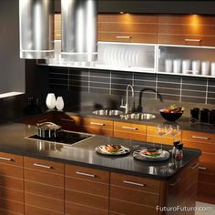 a modern kitchen with stainless steel appliances and wood cabinets