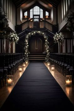 the aisle is lined with candles and flowers for an elegant wedding ceremony at st mary's church