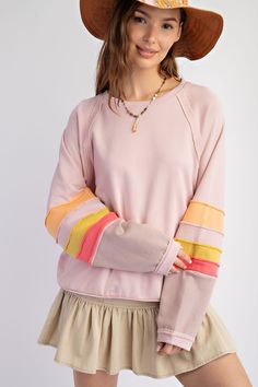 If you're looking for the perfect addition to your wardrobe, you'll love the Easel Loose Fit Terry Knit Top! With its color blocked detailing and raw edging at the sleeves, you'll be sure to stand out! Plus, you'll feel comfy and cozy all day long in the boxy, loose fit of the Easel pullover talk about an easy win! Material and Care 100% Cotton Hand Wash Cold Hang to Dry Measurements Small Bust:48" Length:25.5 ” Sleeve Length:28.5” Medium Bust: 50” Length:26 ” Sleeve Length:29” Large Bust: 52 ” Spring Crew Neck Sweater With Contrast Color, Pink Spliced Top For Fall, Trendy Pink Tops With Splicing, Cotton Sweater With Splicing For Fall, Long Sleeve Sweater With Splicing For Spring, Pink Long Sleeve Sweater With Contrast Color, Pink Patchwork Cotton Sweater, Pink Long Sleeve Top With Contrast Color, Multicolor Striped Sleeve Tops For Spring