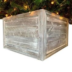 an old wooden box with christmas lights on it