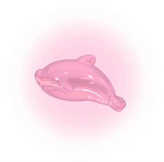 a pink dolphin shaped object floating in the air