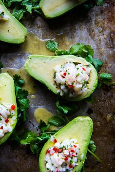 avocado halves with crab salad on them and garnished with cilantro