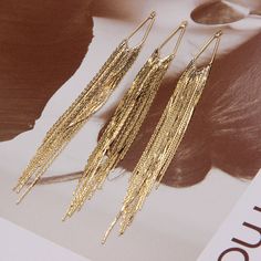 18K Gold Plated Tassel Charm, Waterfall Pendant, Fringe Bracelet, Long Tassel Necklace, Tassel Earring, Gold Chain Charm, Dangle Earrings material: copper, brass size:  12.5CM*1.8CM NOTE: This item is made in China Gold Metal Tassel Earrings With Fringe, Gold Metal Fringe Tassel Earrings, Gold Dangle Tassel Earrings, Gold Dangle Tassel Earrings With Fringe, Gold Fringe Tassel Dangle Earrings, Gold Dangle Tassel Earrings With Latkans, Gold Fringe Tassel Earrings, Fringe Bracelet, Long Tassel Necklace