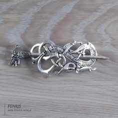 Dragon Knot Work Hair Pin Knot work dragon holds hair buns, pony tails or other hair styles. Secures with dragon head metal pin. Metal: Silver alloySize: 2.75 width Dragon Hair Pin, Dragon Hair, Celtic Viking, Work Hair, Pony Tails, Hair And Makeup Tips, Hair Buns, Work Hairstyles, Viking Style