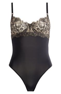 Full of romantic charm, this bodysuit is trimmed with lovely lace and punctuated with adjustable straps for a personalized fit. Adjustable straps Cotton-lined gusset 86% nylon, 14% elastane with 51% cotton, 49% nylon contrast Hand wash, line dry Imported Elegant Sleeveless Bodysuit With Built-in Bra, Fitted Lace Shapewear Bodysuit, Lace Shapewear Bodysuit Fitted, Lace Bodysuit With Spaghetti Straps For Summer, Elegant Bodysuit With Sweetheart Neckline And Lined Body, Summer Lace Bodysuit With Spaghetti Straps, Sleeveless Lace Bodysuit With Built-in Bra, Nylon Bodysuit With Spaghetti Straps And Adjustable Straps, Nylon Bodysuit With Adjustable Spaghetti Straps