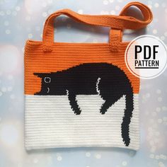 an orange and white bag with a black bear on it