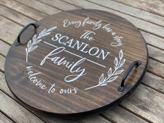 a wooden sign that says every family has the sanlon family here to ourss