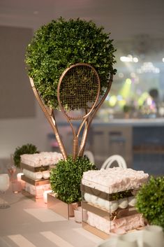 a table topped with cakes and tennis rackets