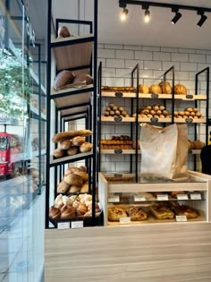 a bakery filled with lots of bread and pastries