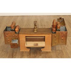 an old fashioned wooden desk with drawers and knobs