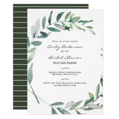 a wedding card with green leaves and greenery on it, in the shape of a circle