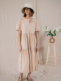 Relaxed Cotton Dress For Garden Party, Relaxed Fit Cotton Dress For Garden Party, Cotton Midi Dress With Ruffle Hem For Garden Party, Summer Cotton Midi Dress With Ruffle Hem, Spring Cotton Midi Dress With Ruffle Hem, Beach Tiered Cotton Dress With Ruffle Hem, Tiered Cotton Maxi Dress For Garden Party, Cotton Tiered Dress With Ruffle Hem For Beach, Beach Cotton Midi Dress With Ruffle Hem