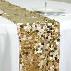 Create a dazzling look for your event with table runner from Balsa Circle! WHAT YOU GET: Each order is for one (1) table runner. Each runner measures approx. 13" wide x 108" long. Each runner will drop 24" from each side of a standard 60" wide table. Sequins size: 0.7" or 18 mm. Material: Mesh base covered with big shiny round sequins. Edges are hemmed. Fabric Care: Do not dry clean or machine wash. Wipe with a soft damp cloth. Please note, other decorations are sold separately. Our new sequin t Banquet Table Decorations, Restaurant Table Tops, Sequin Table Runner, High Top Tables, Sequin Table, Pub Set, Table Overlays, Bridal Table, Banquet Tables