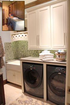 a washer and dryer in a small laundry room with cabinets on the wall