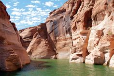 the water is green and clear in the canyons that surround it's cliffs