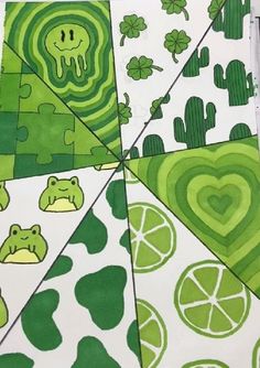 a green and white design with hearts, oranges, and other things on it