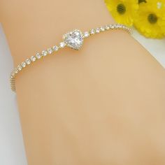 "14K Gold Plated Icy CZ Heart Love Bracelet. Tennis Style. Elegant. Oro Laminado. A B O U T We offer high quality jewelry for all. All items are nicely packaged. Thank you for shopping with us ❤️ Feel free to send a message if you have any questions! * Color: Gold * Main Stone Color: White/Colorless * Gender: Female * Metal: Yellow Gold Plated * Main Stone: Cubic Zirconia * Brand: MyDivineSpace * Type: Bracelet * Main Stone Shape: Heart * Style: Chain * Base Metal: Alloy * Theme: Love & Hearts * Wedding Tennis Bracelet For Valentine's Day, Valentine's Day Tennis Bracelet For Wedding, Valentine's Day Wedding Tennis Bracelet, Gold Cubic Zirconia Tennis Bracelet For Valentine's Day, Gold Cz Tennis Bracelet For Valentine's Day, Heart Shaped Tennis Bracelet For Weddings, Gold Heart Cut Tennis Bracelet For Anniversary, Cubic Zirconia Heart Bracelet For Weddings, Heart-shaped Cubic Zirconia Tennis Bracelet For Valentine's Day