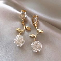 High Grade Clear Glass Tear Drop. Acrylic Rose Design At The Bottom. Gold Tone. Lightweight With Post Backing. Classic Feminine Design. Earrings Are 2 Inches In Length. So Pretty!