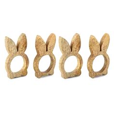 three wooden rings with ears on them