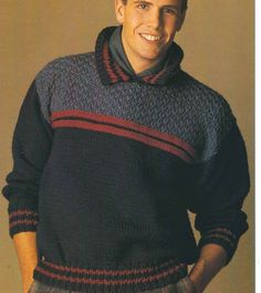 a young man wearing a sweater and smiling at the camera with his hands in his pockets