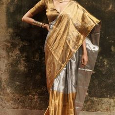 Two Toned Cotton Tissue Half And Half Saree Set. Gold And Silver Color. Blouse Is Fully Stitched, New Never Worn. Blouse Is Also Half And Half, Golden Part Of The Blouse Is The Front And Silver Is Back. Pallu Part Of The Saree Is Silver Thus Blouse Front Is Golden To Create The Contrast. No Petticoat But It Can Be Worn With Any Light Gold Or Nude Tone Color Petticoat. Fall Is Pico Is Done Blouse Measurement Bust - 36” ( Has Margin To Open Upto 38”) Blouse Doesn’t Have Padded Bra You Can Wear Bra Silver Tissue Silk Pre-draped Saree For Festive Occasions, Fitted Silver Saree With Zari Work, Fitted Silver Pre-draped Saree With Zari Work, Silver Fitted Pre-draped Saree With Zari Work, Festive Silver Tissue Silk Blouse Piece, Elegant Silver Pre-draped Saree For Festive Occasion, Festive Silver Fitted Saree, Elegant Silver Tissue Silk Blouse Piece, Elegant Silver Tissue Silk Pre-draped Saree